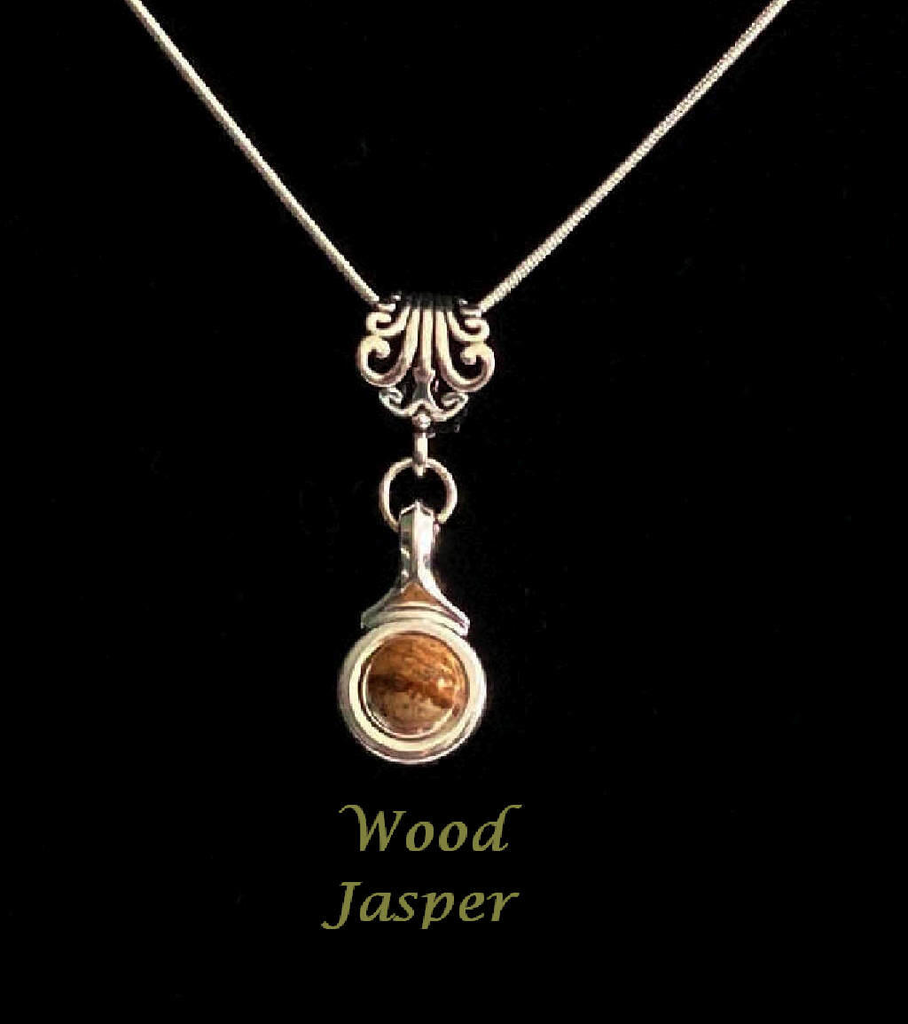 Beautiful Wood Jasper stone is viewed on a flute trill key.  A fleur de lis bail on a  16" silver plated snake chain.