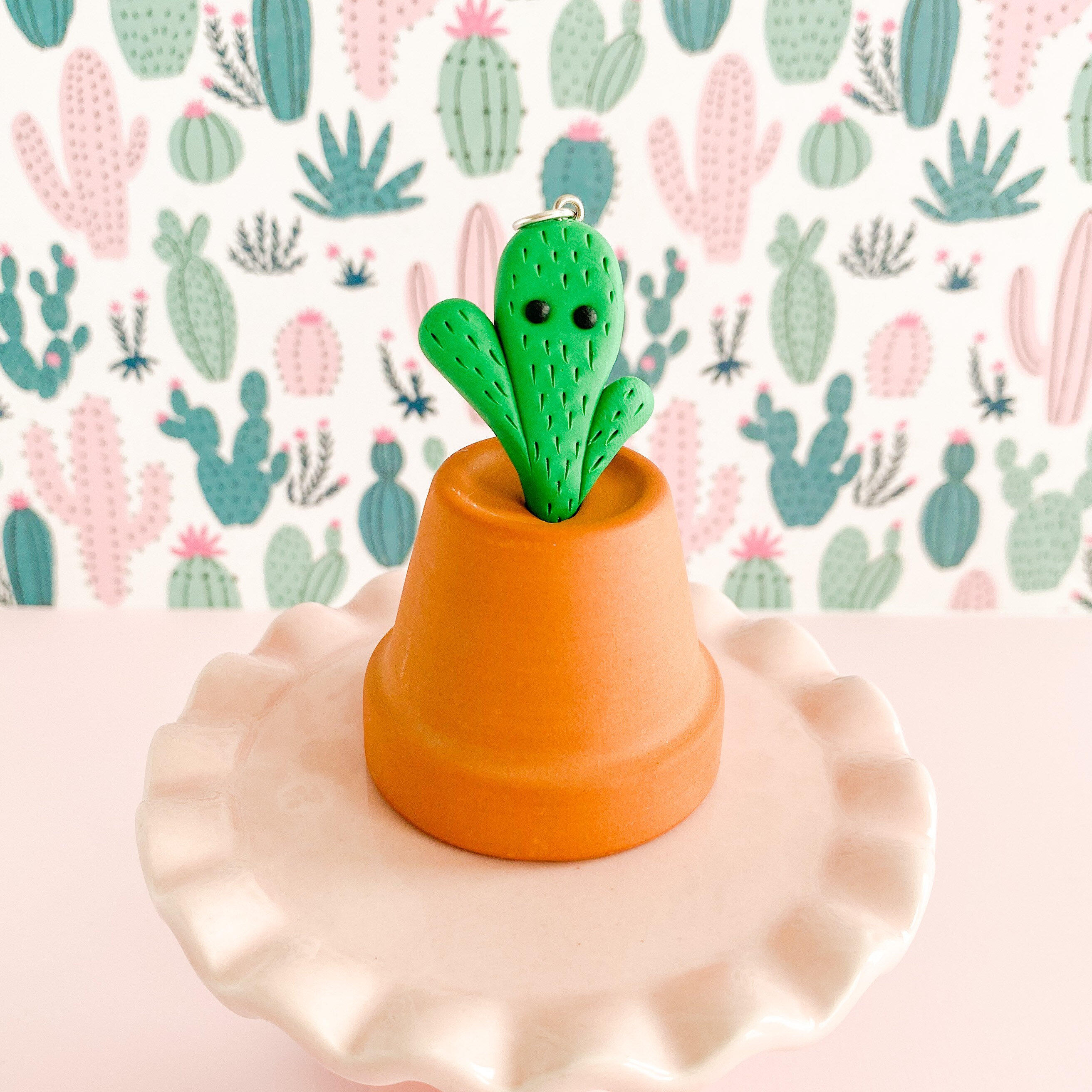 fireflyFrippery Cactus Charm with eyes Displayed on Upside Down Miniature Terra Cotta Pot