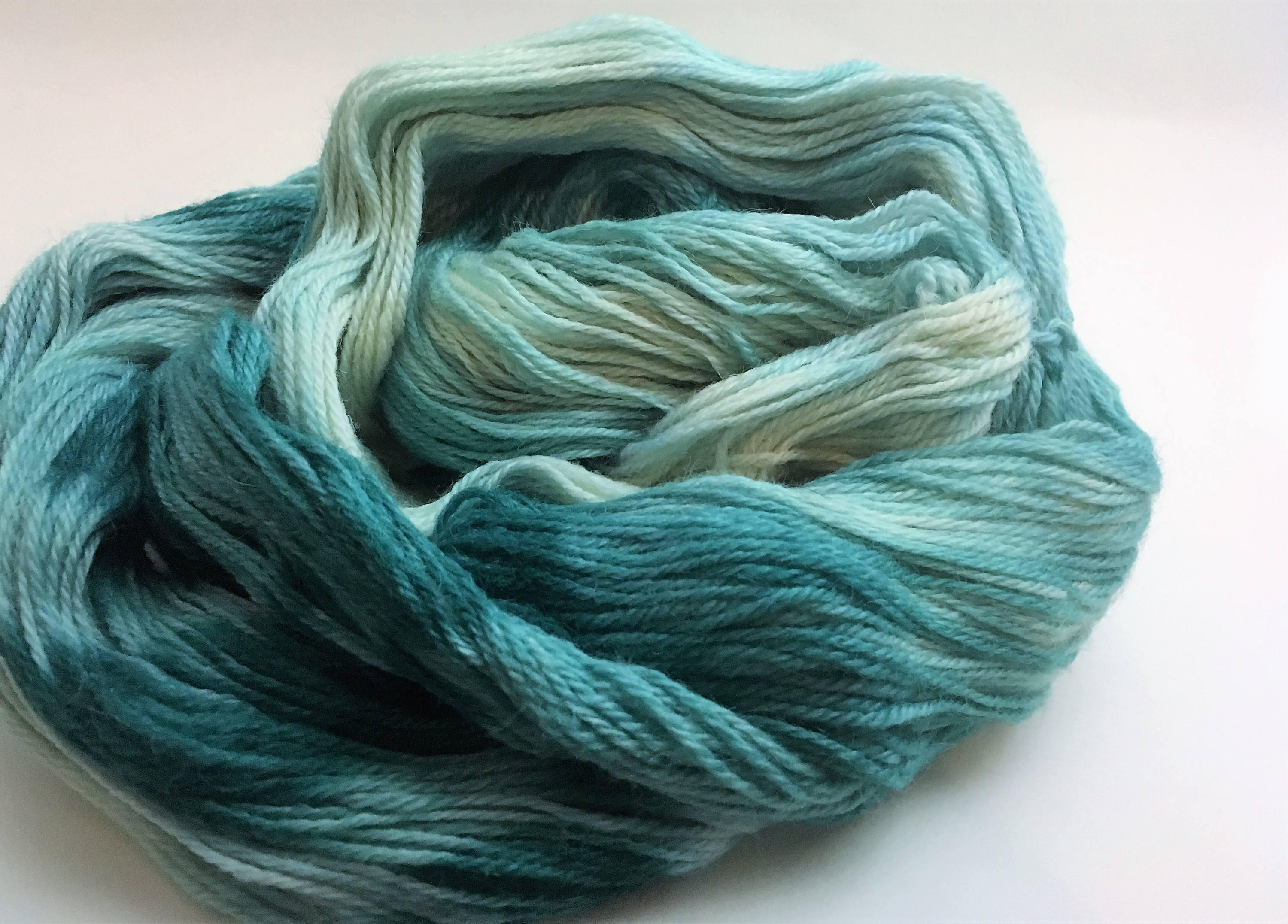 Yarn: Variegated dark green alpaca DK yarn