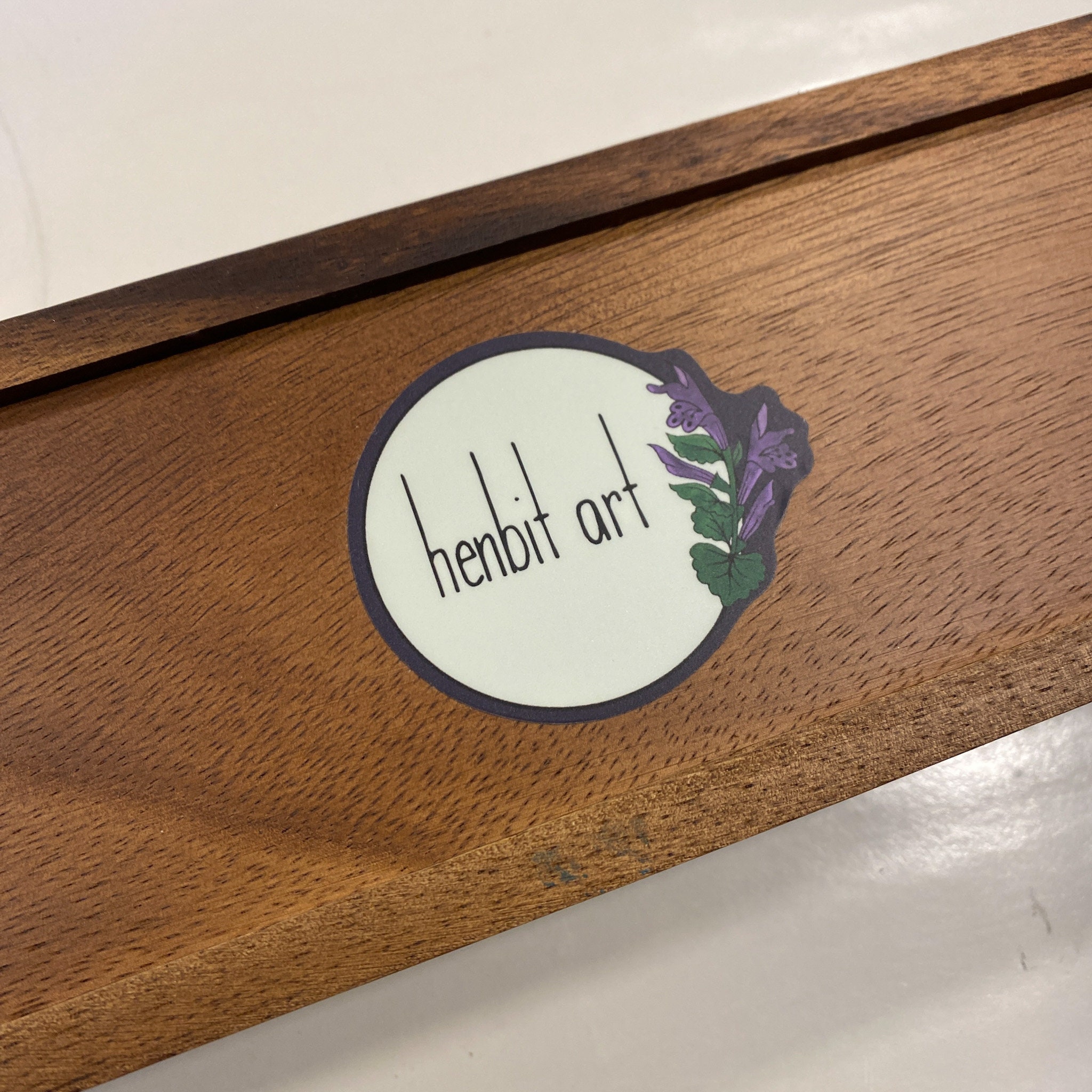 Logo on bottom of tea chest.