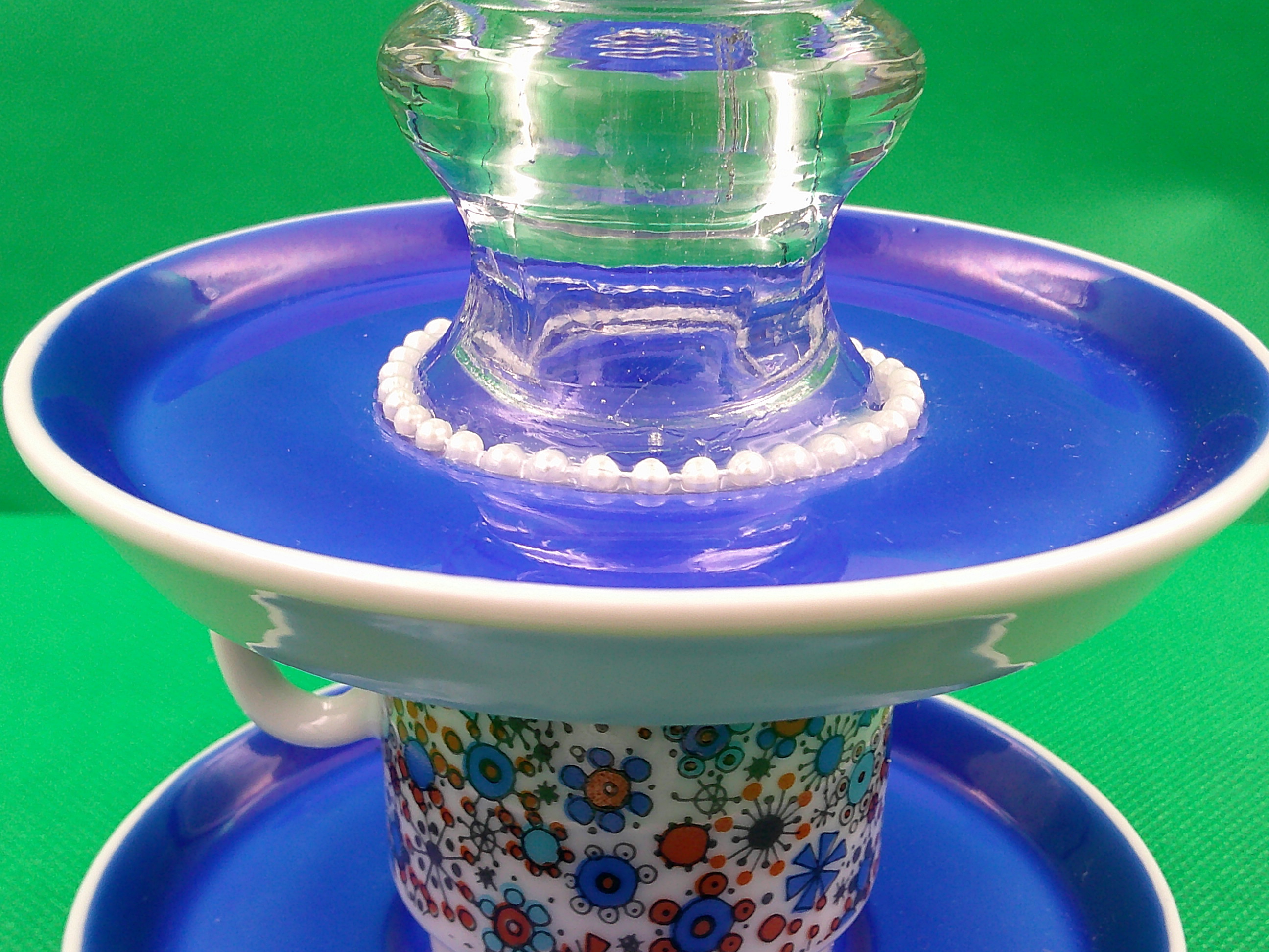A close up of the candleholder and the pearls. A close up of the candleholder and the pearls.
