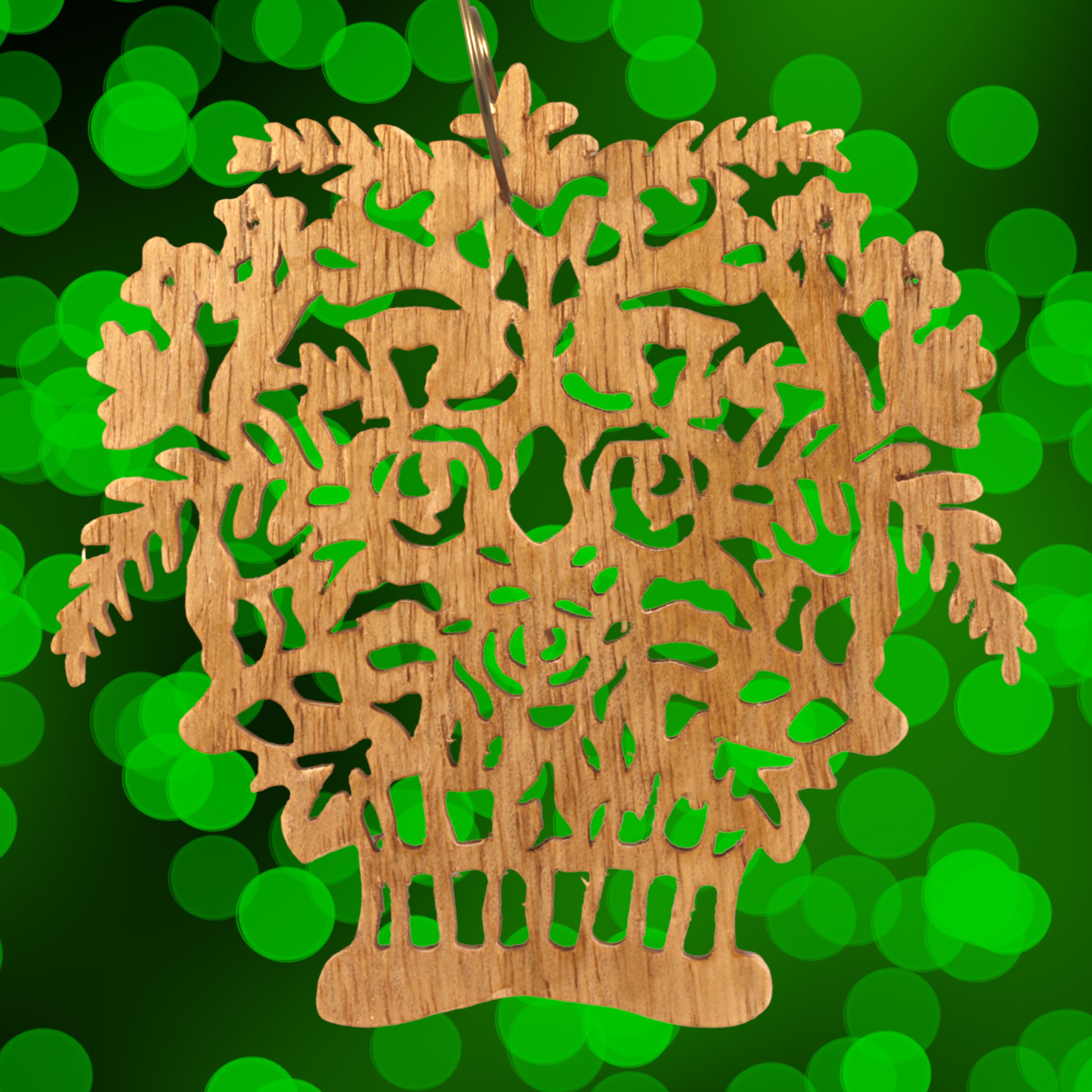 A handcrafted Victorian-style wooden Christmas tree ornament shaped like a basket filled with intricate floral designs, featuring detailed leaves and blossoms, with a small hook at the top for hanging.