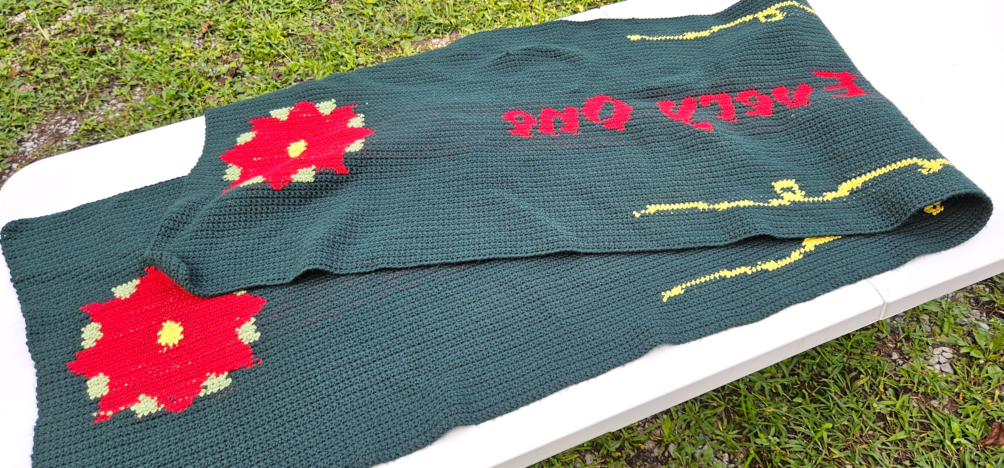 A photo of the table runner folded in half to show that the back and the front side look the same. A photo of the table runner folded in half to show that the back and the front side look the same.