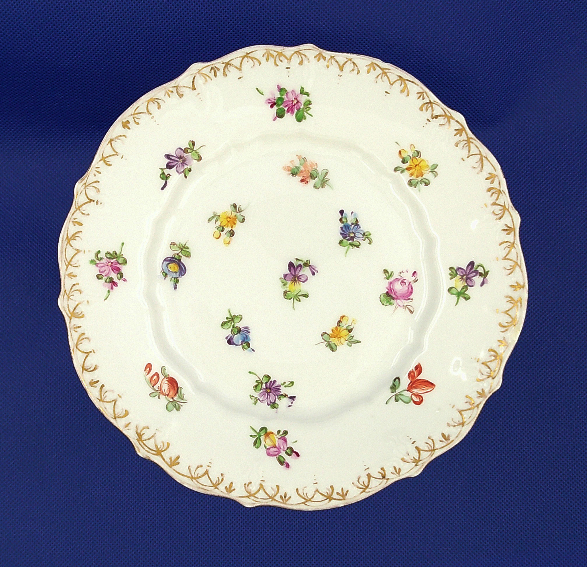 A view from the top down. The top dish has quite a variety of colorful flowers. A view from the top down. The top dish has quite a variety of colorful flowers.