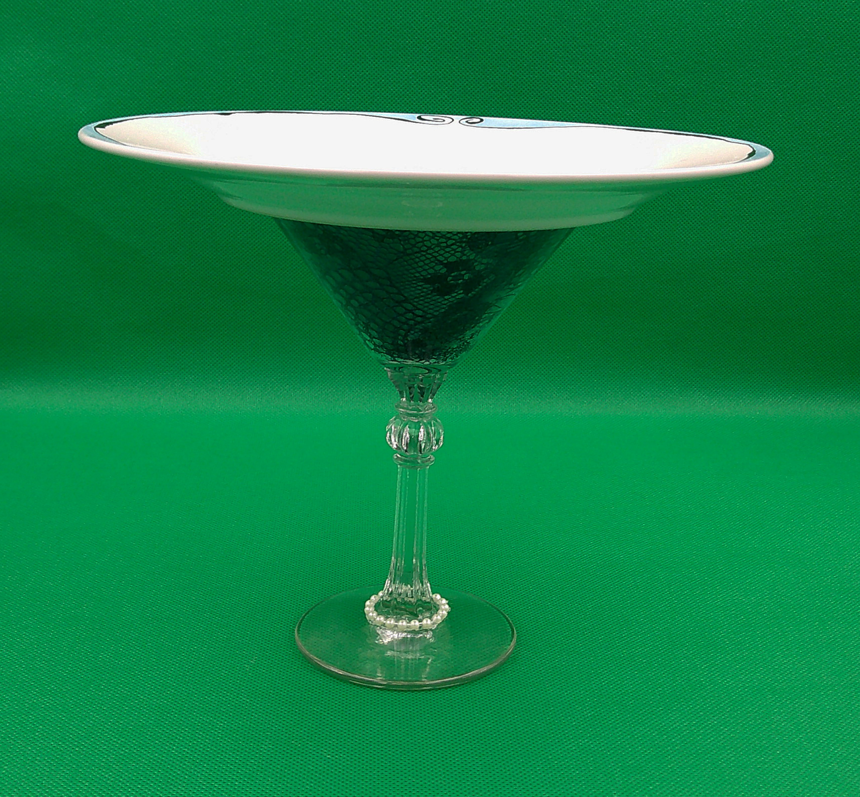 This view shows a side view of the plate and martini glass with lace and pearls. It's not quite 7 inches tall by 8 inches wide. This view shows a side view of the plate and martini glass with lace and pearls. It's not quite 7 inches tall by 8 inches wide.
