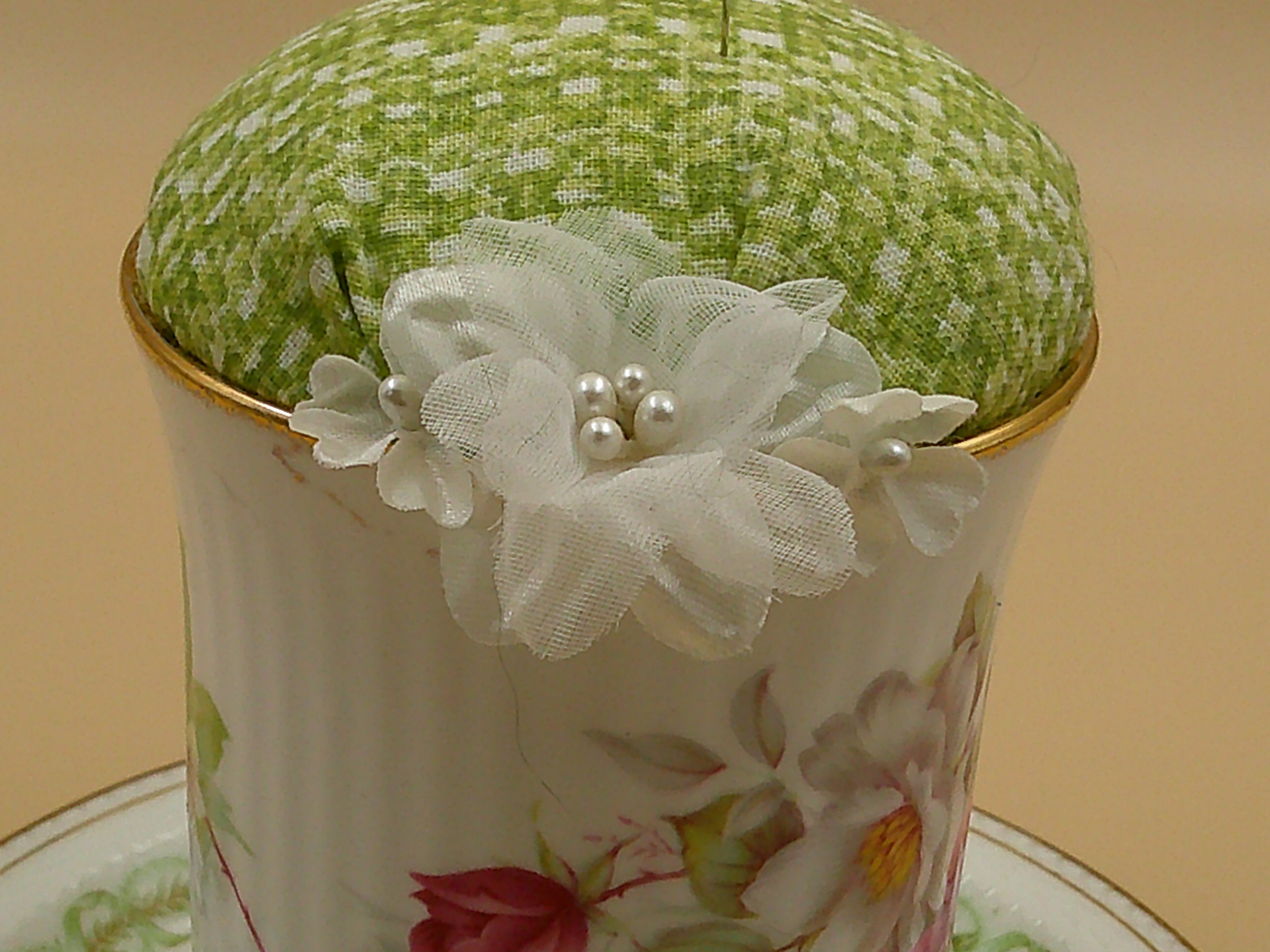 This closeup shows the flowers that are covering the cup's blemish. This closeup shows the flowers that are covering the cup's blemish.