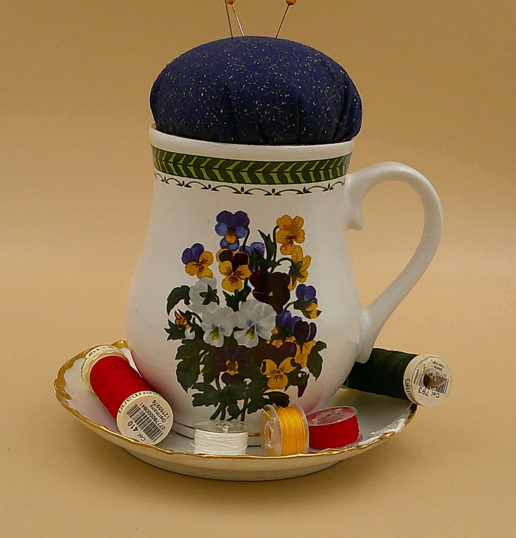 This shows an example of bobbins and thread in the holder. They are not included in the sale. This shows an example of bobbins and thread in the holder. They are not included in the sale.