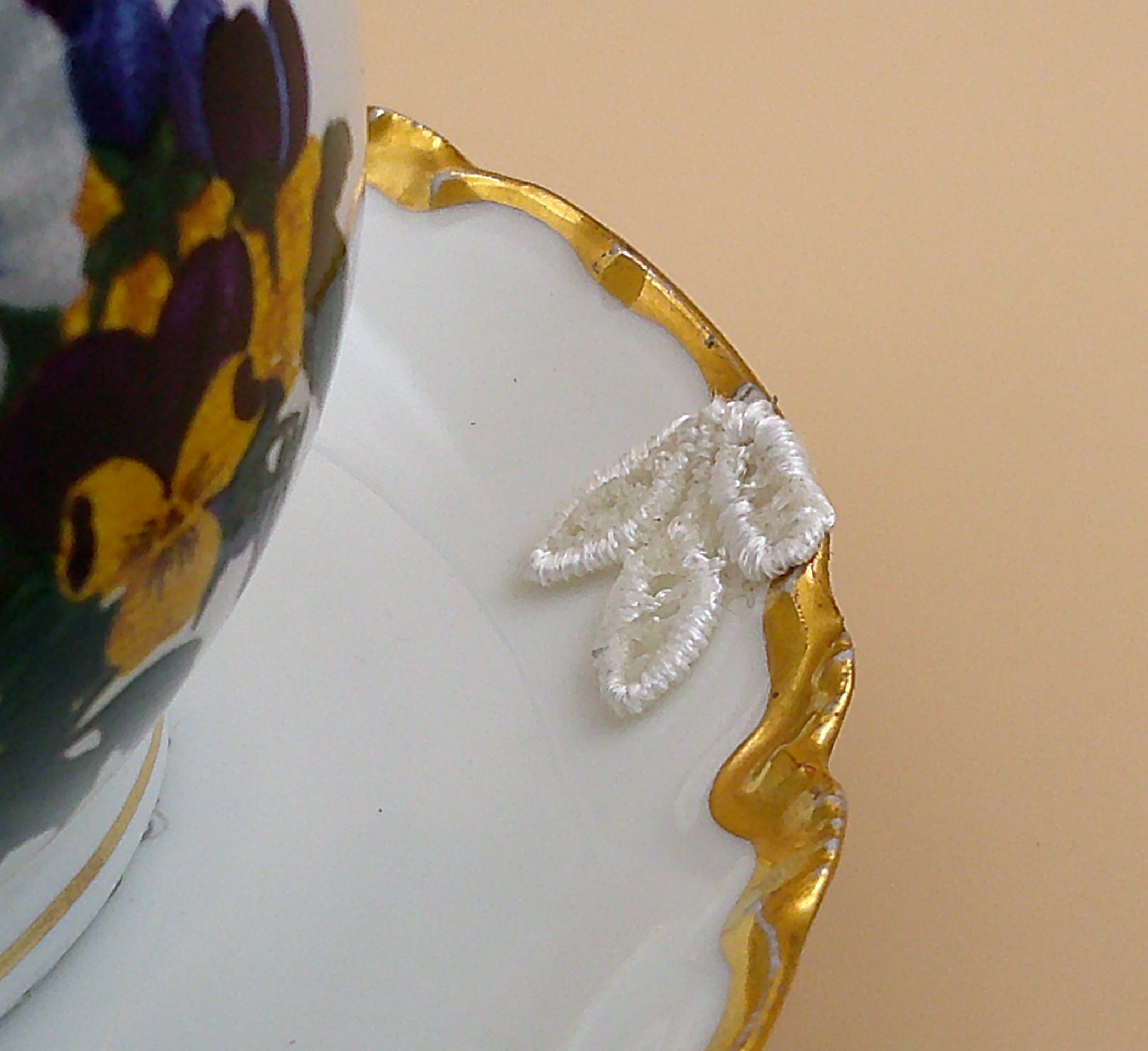 This is a closeup of the lace leaves that were used to enhance the blemish of the saucer. This is a closeup of the lace leaves that were used to enhance the blemish of the saucer.
