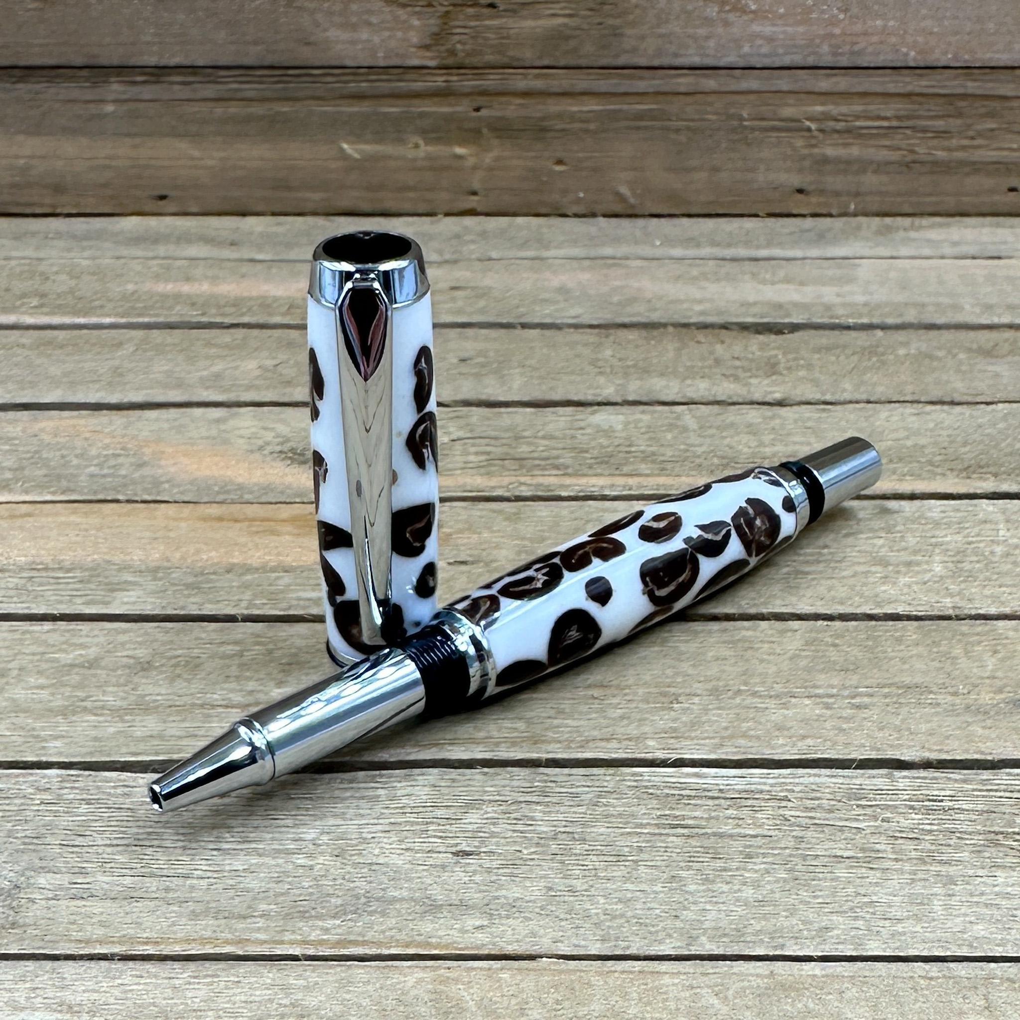 Capped rollerball pen with coffee beans in white resin  Capped rollerball pen with coffee beans in white resin