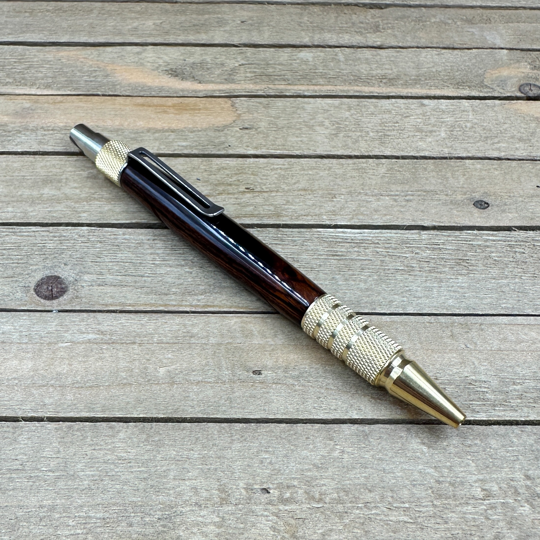 Dark wood and brass click pen  Dark wood and brass click pen