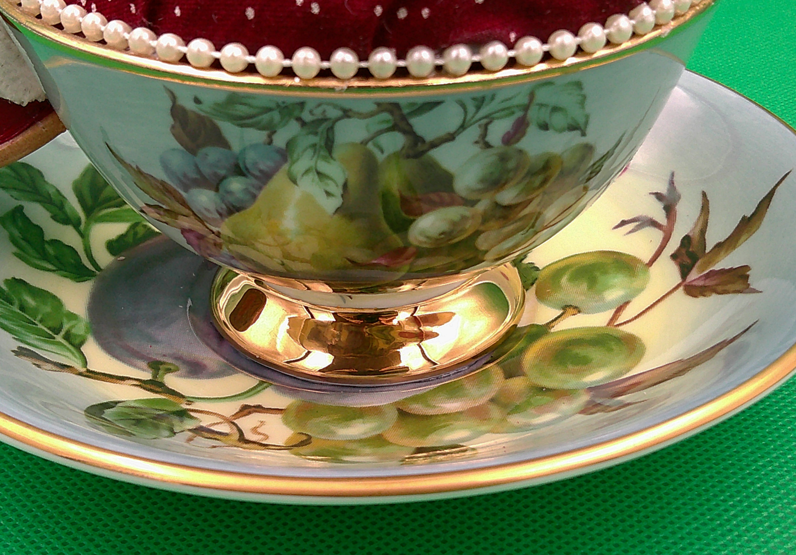 This shows details of the hand painting on the cup and saucer. This shows details of the hand painting on the cup and saucer.