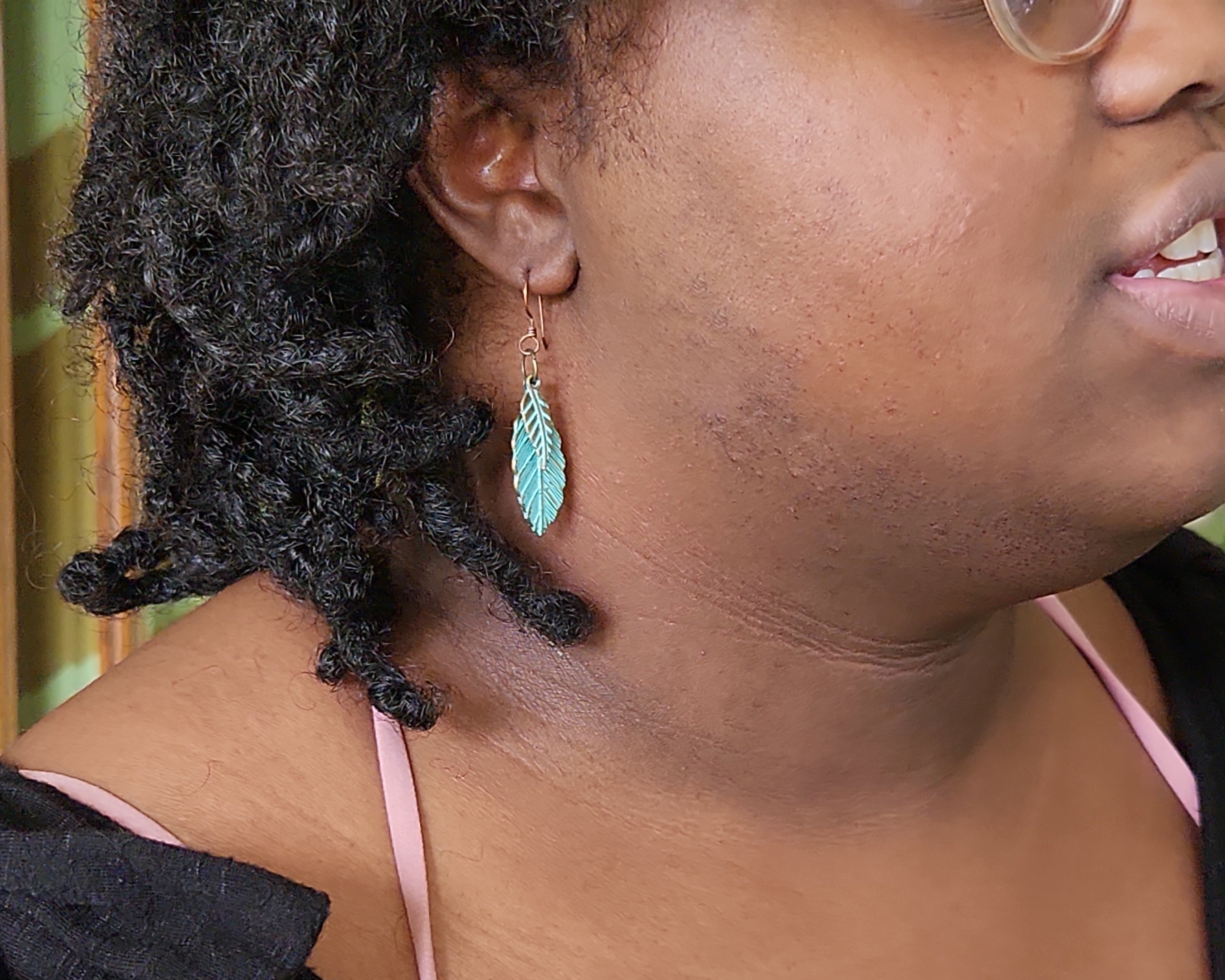 Double Leaf earrings modeled by Vanessa Byrd. Double Leaf earrings modeled by Vanessa Byrd.