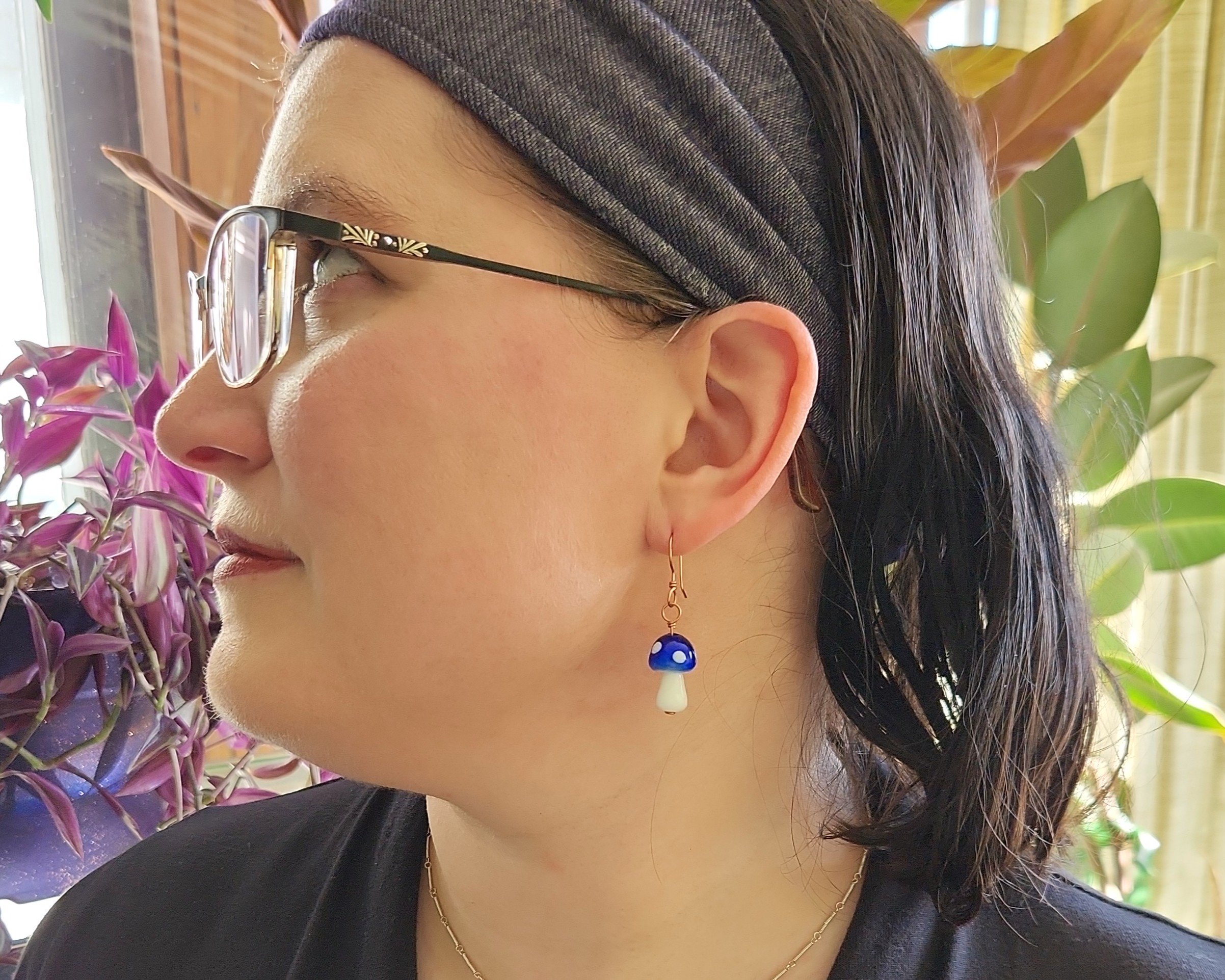 Earrings modeled by Joy Kizior Earrings modeled by Joy Kizior