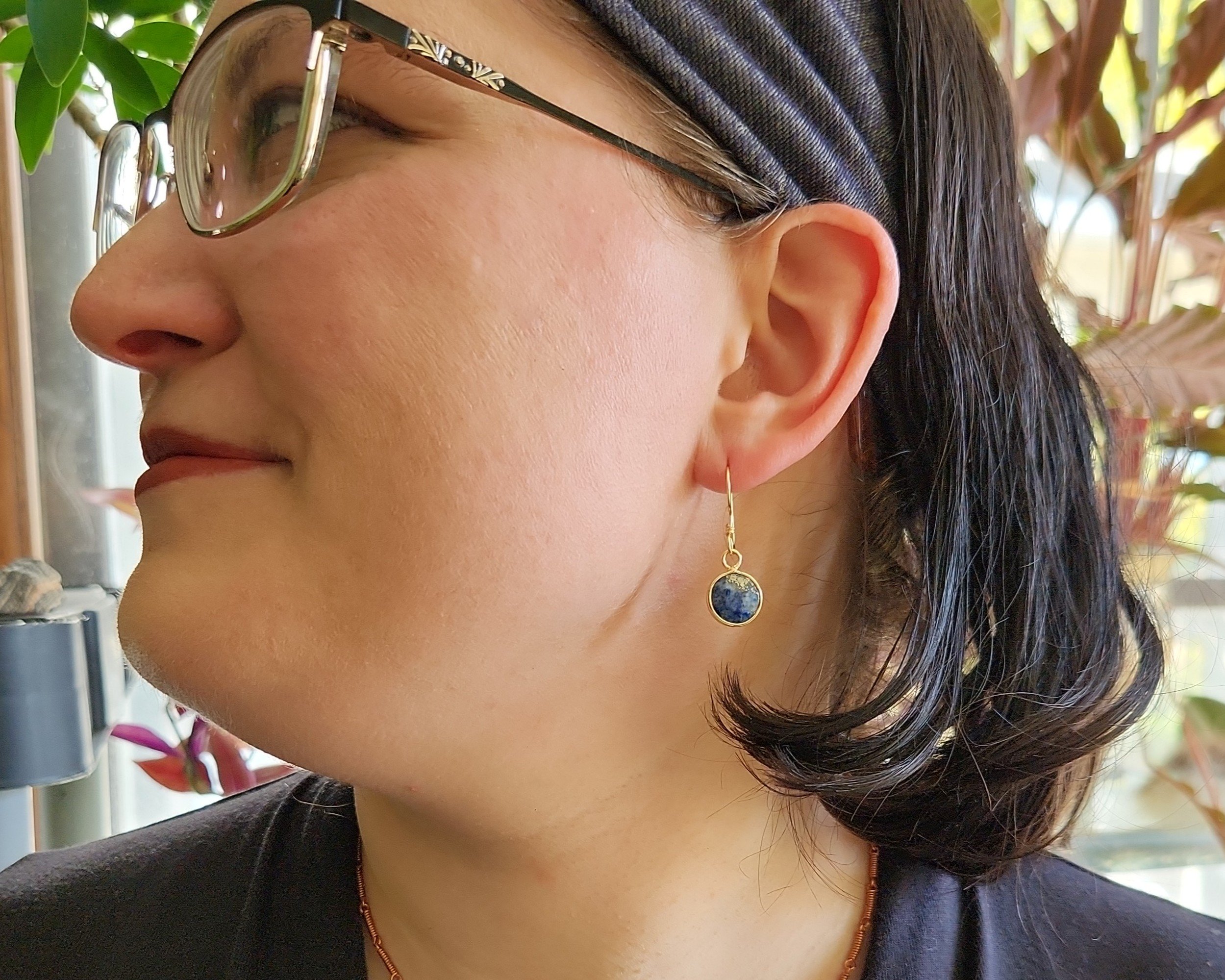 Earrings modeled by Joy Kizior Earrings modeled by Joy Kizior