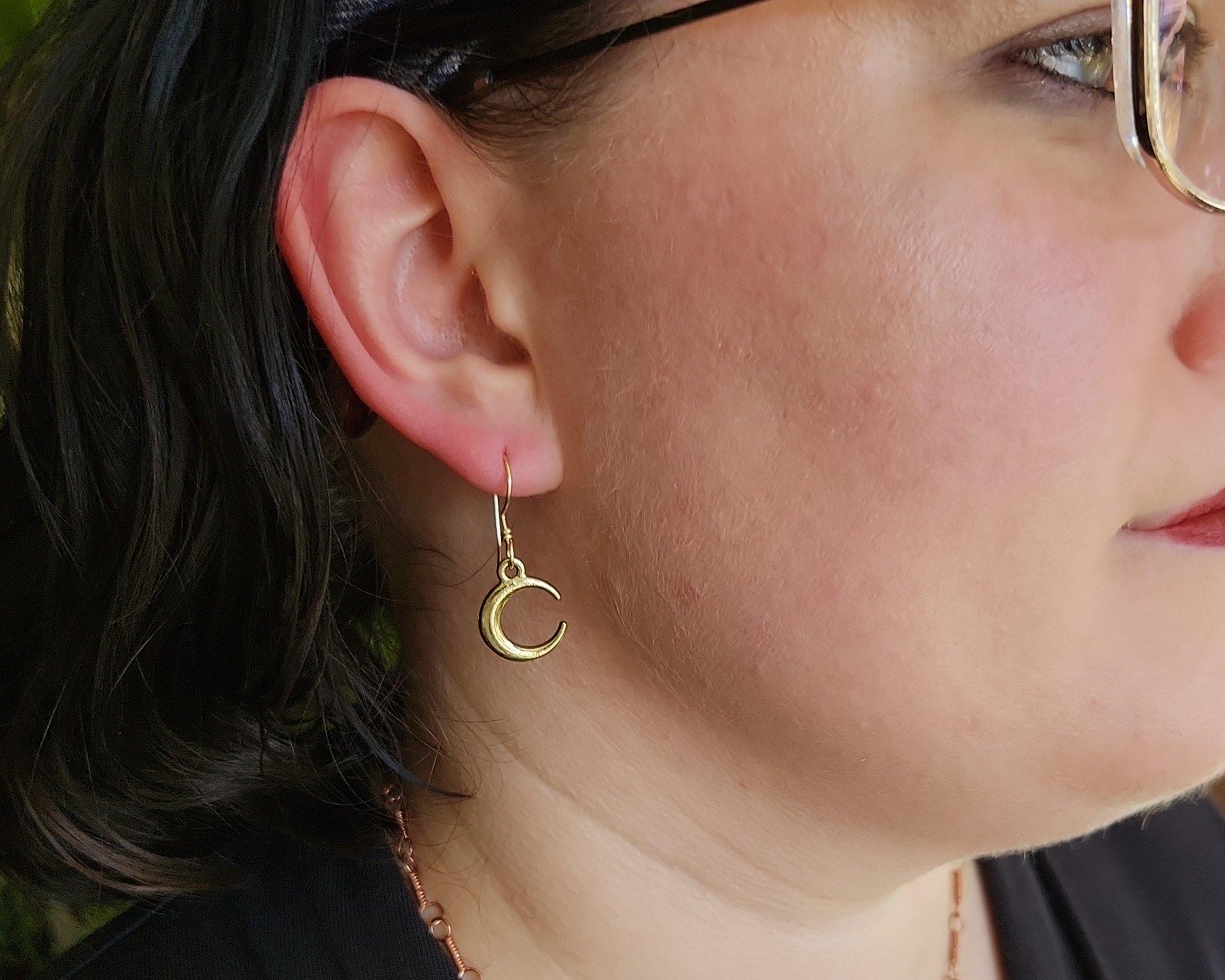 Earrings modeled by Joy Kizior Earrings modeled by Joy Kizior