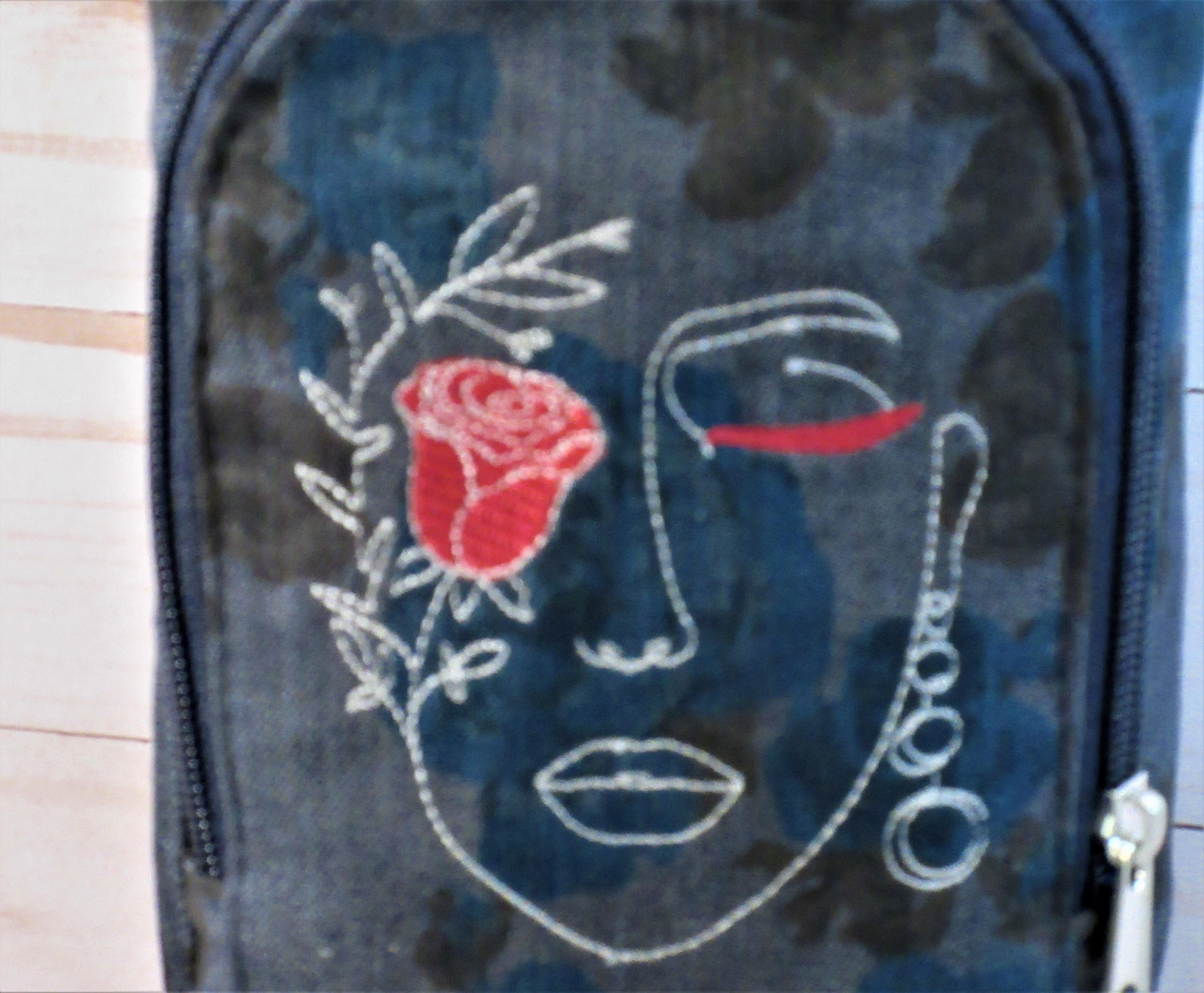 Lady with Rose on Denim Rose print  Cross Body Water Bottle Sling Bag with wallet pocket. close up of embroidery