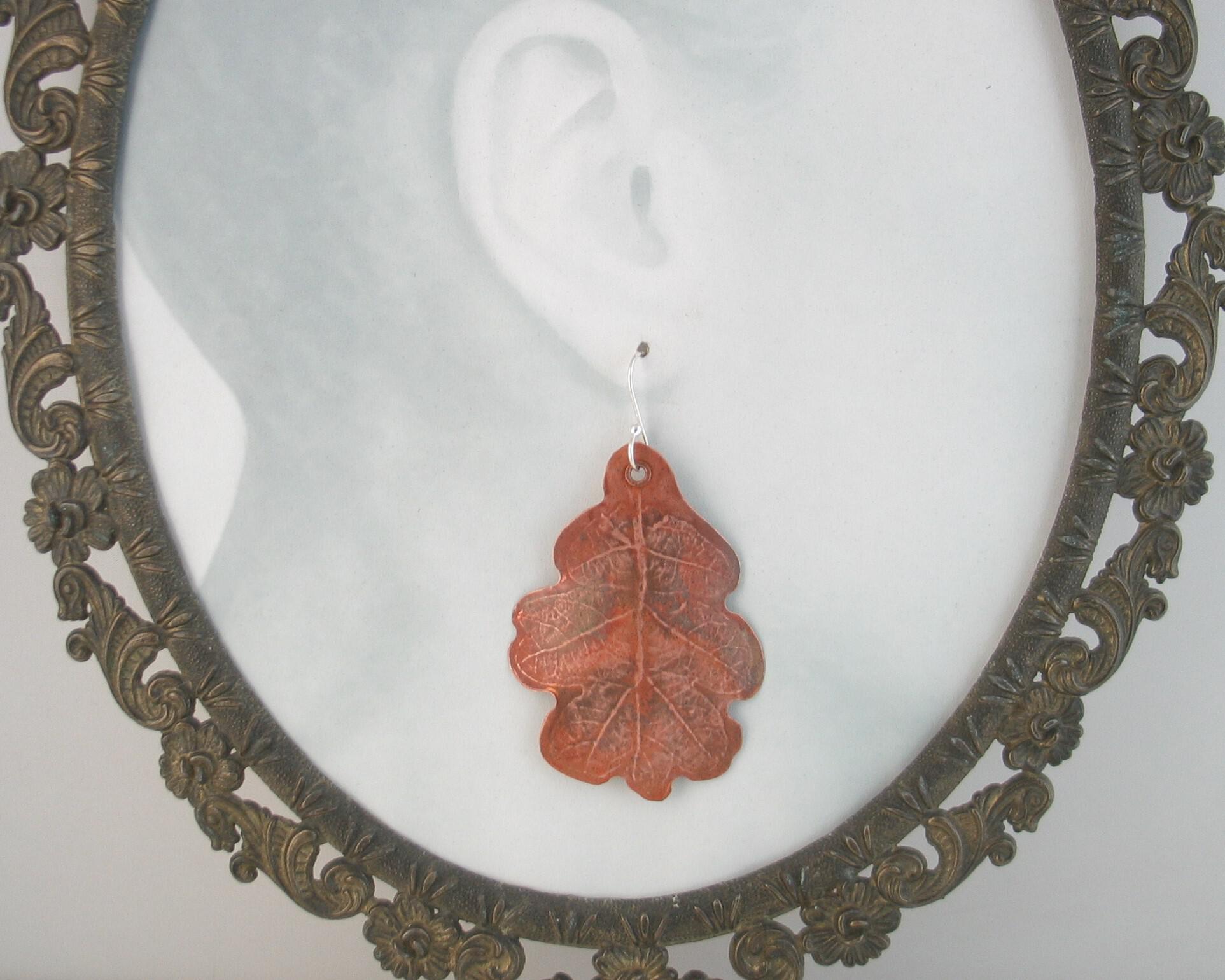 Copper Oak Leaf Earring on Framed photo of head