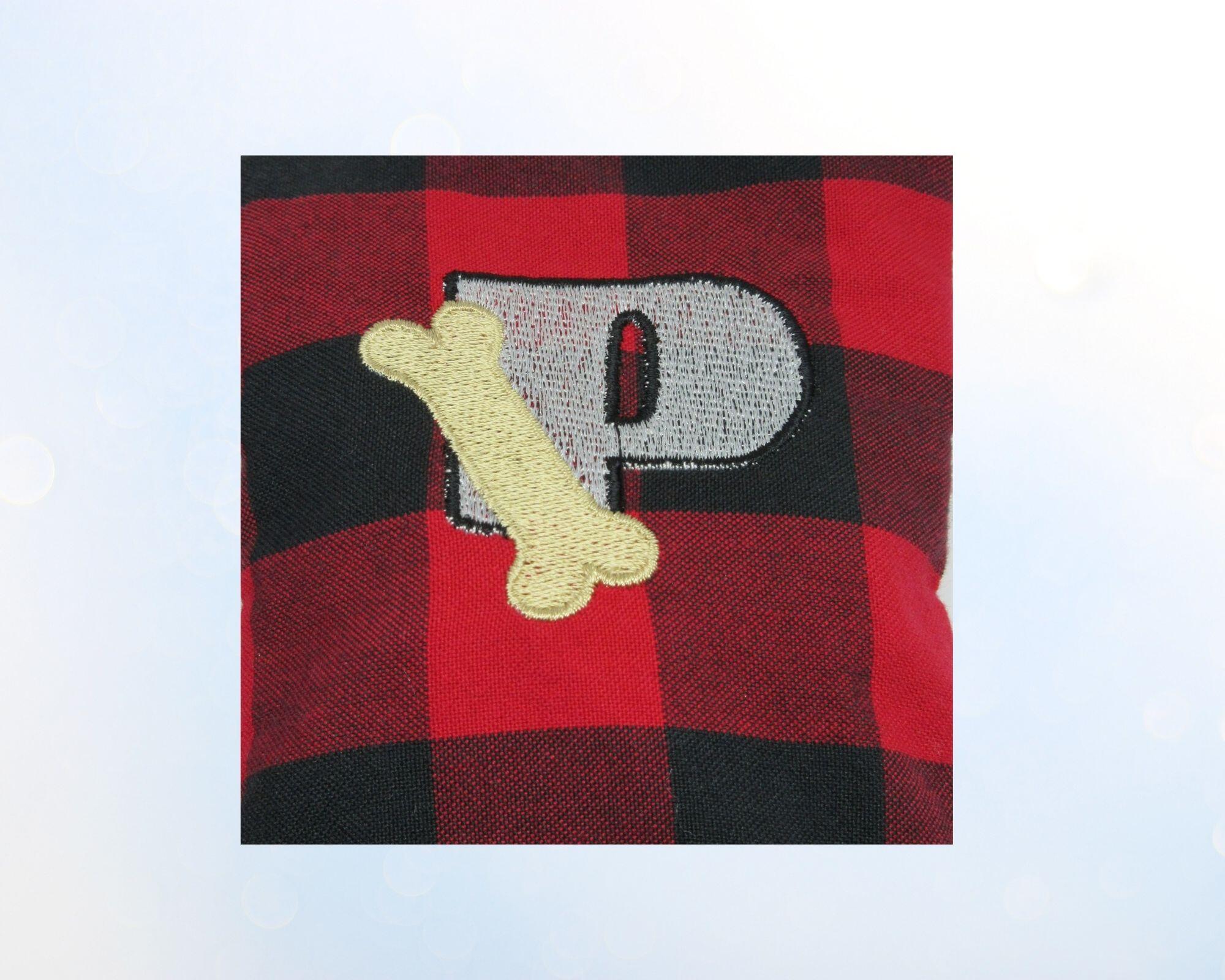 Personalized Buffalo plaid dog poop bag holder,  red and black plaid with bone motif with a  personalized Embroidered letter