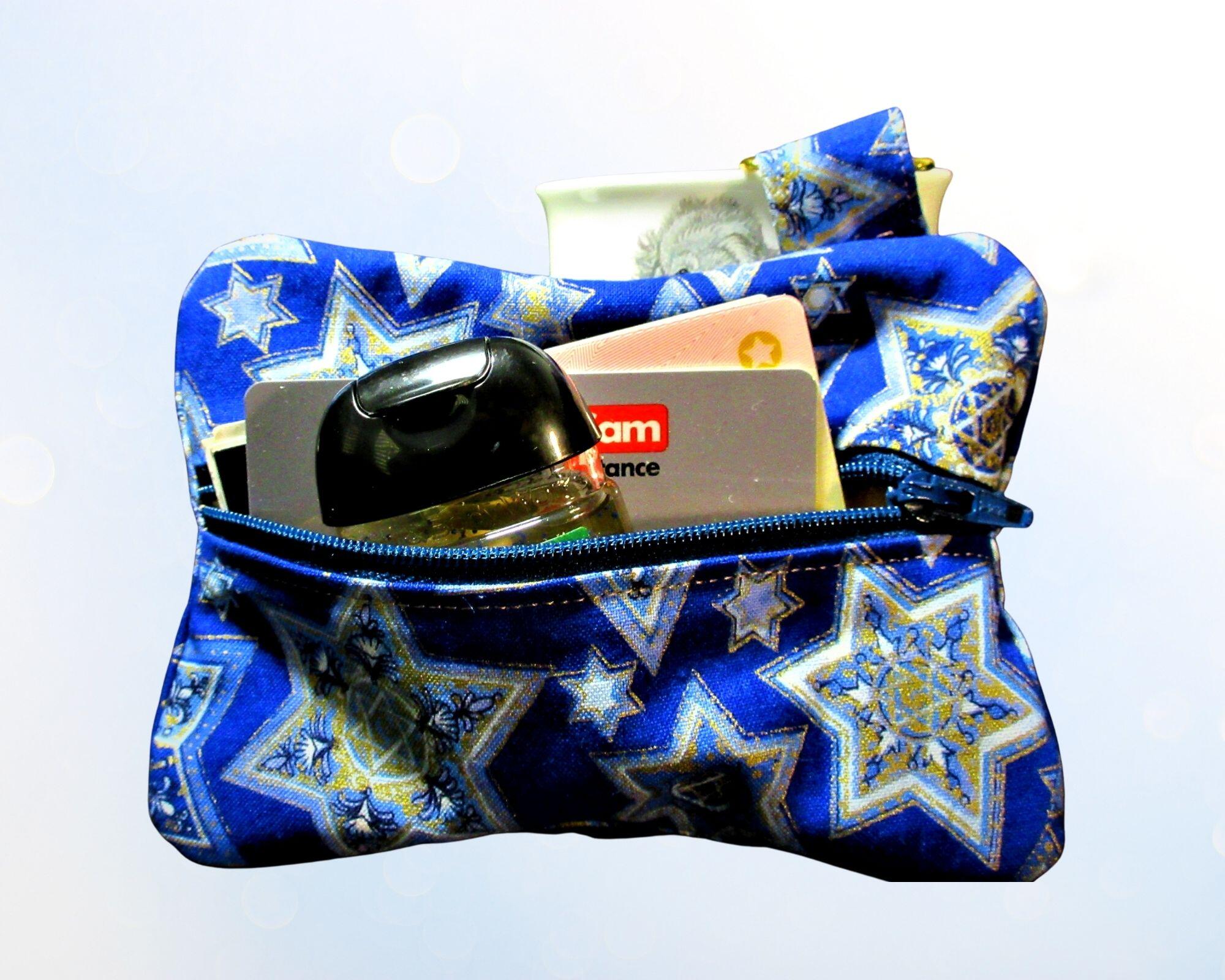 filled with hand sanitizer and money 
Jewish star 6 points blue and gold with gold tone hardware Multi purpose pouch Handmade by a Fur Baby Favorite dog poop bag holder waste bag dispenser training treat pouch binky pacifier bag change purse pouch
