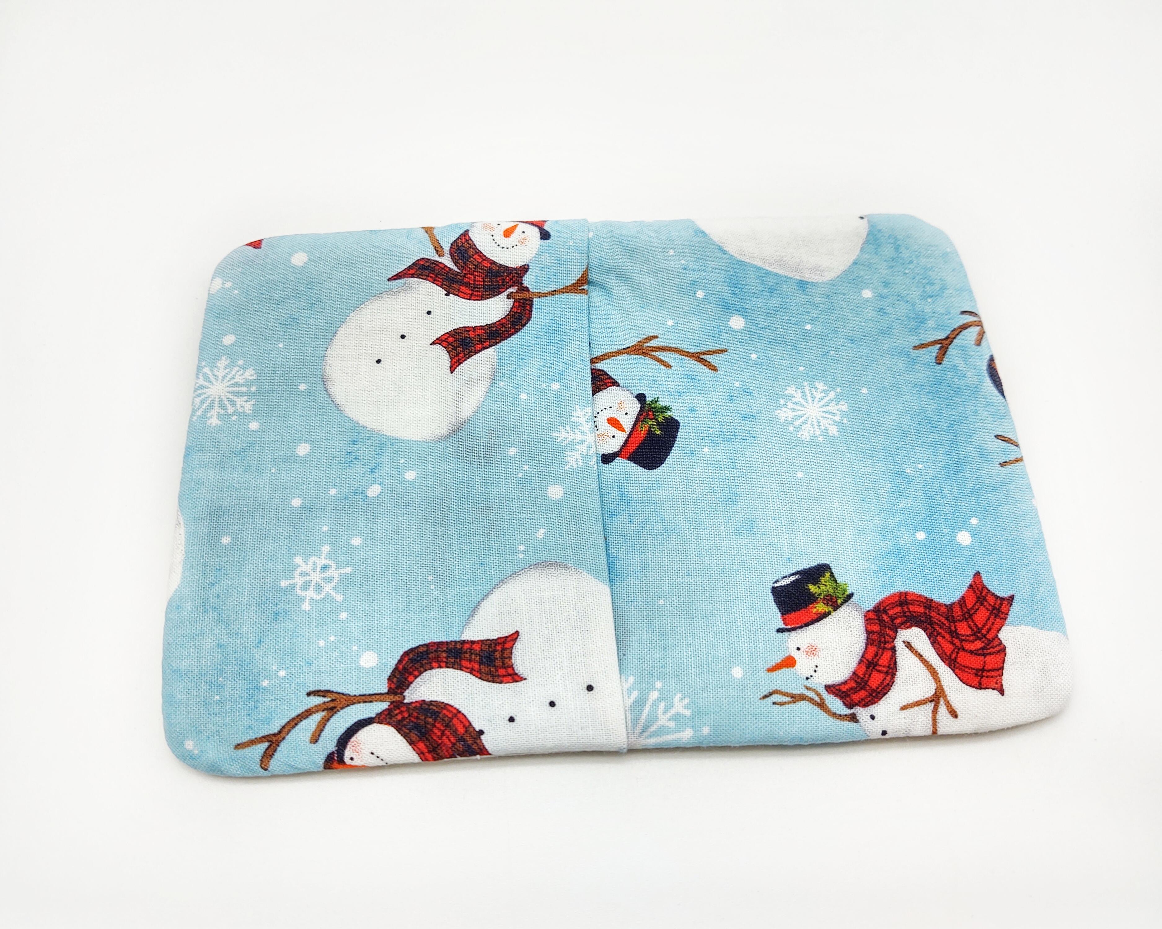 Back is the same snowman print and is an envelope closure.