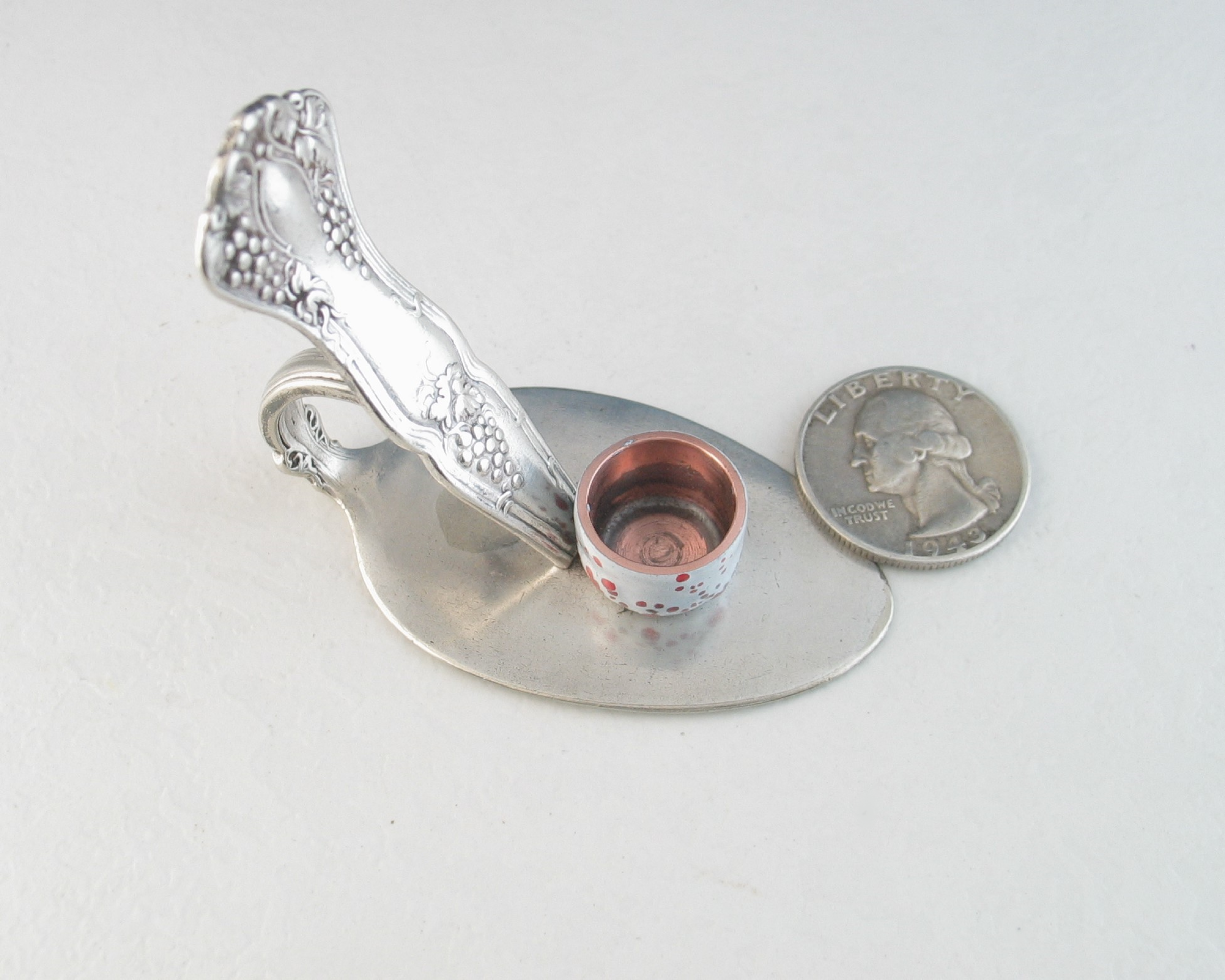 vintage silver plated spoon made into a tiny candle holder