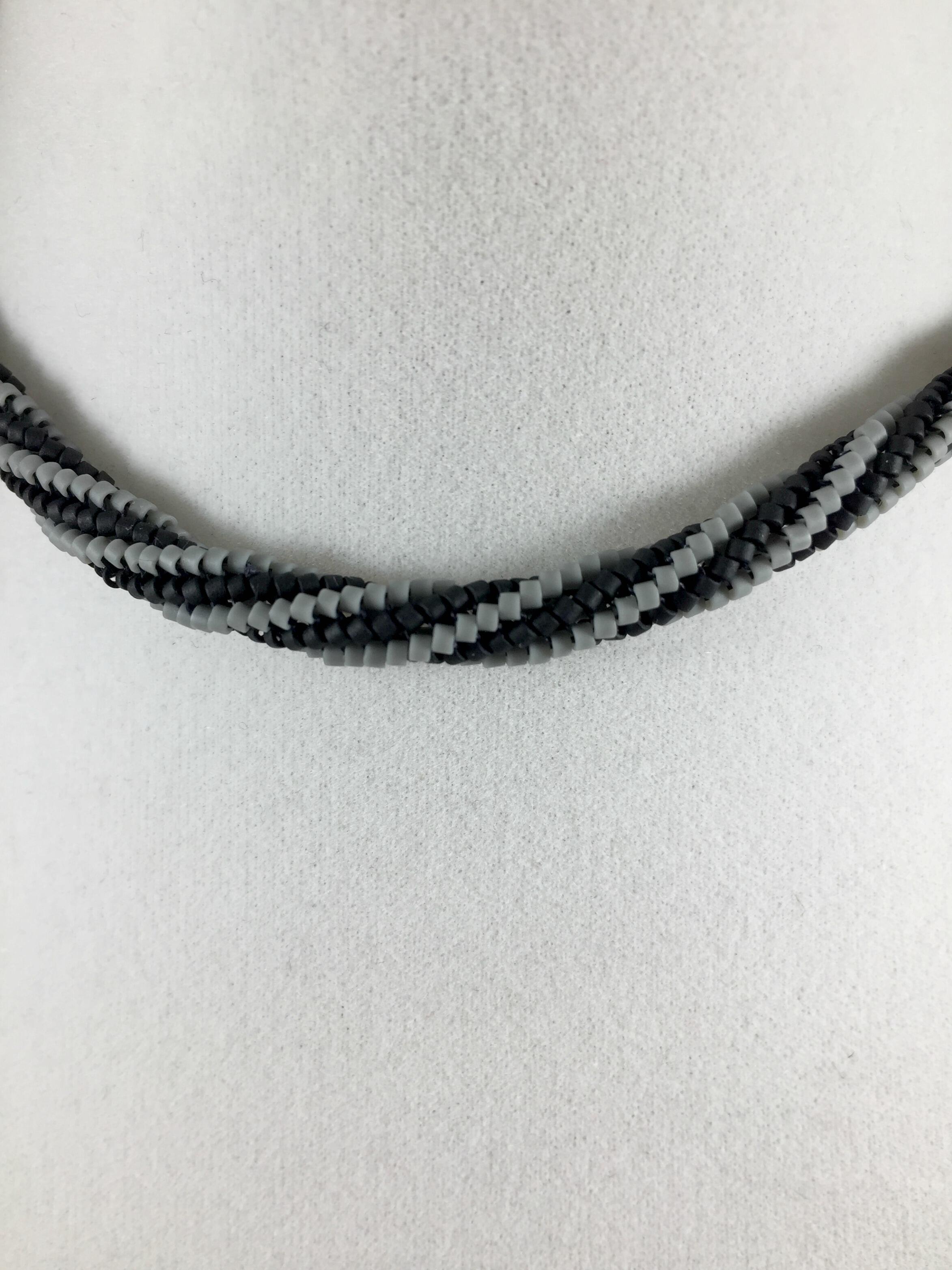 Detail image of hand woven black and grey tubular Herringbone beaded necklace 