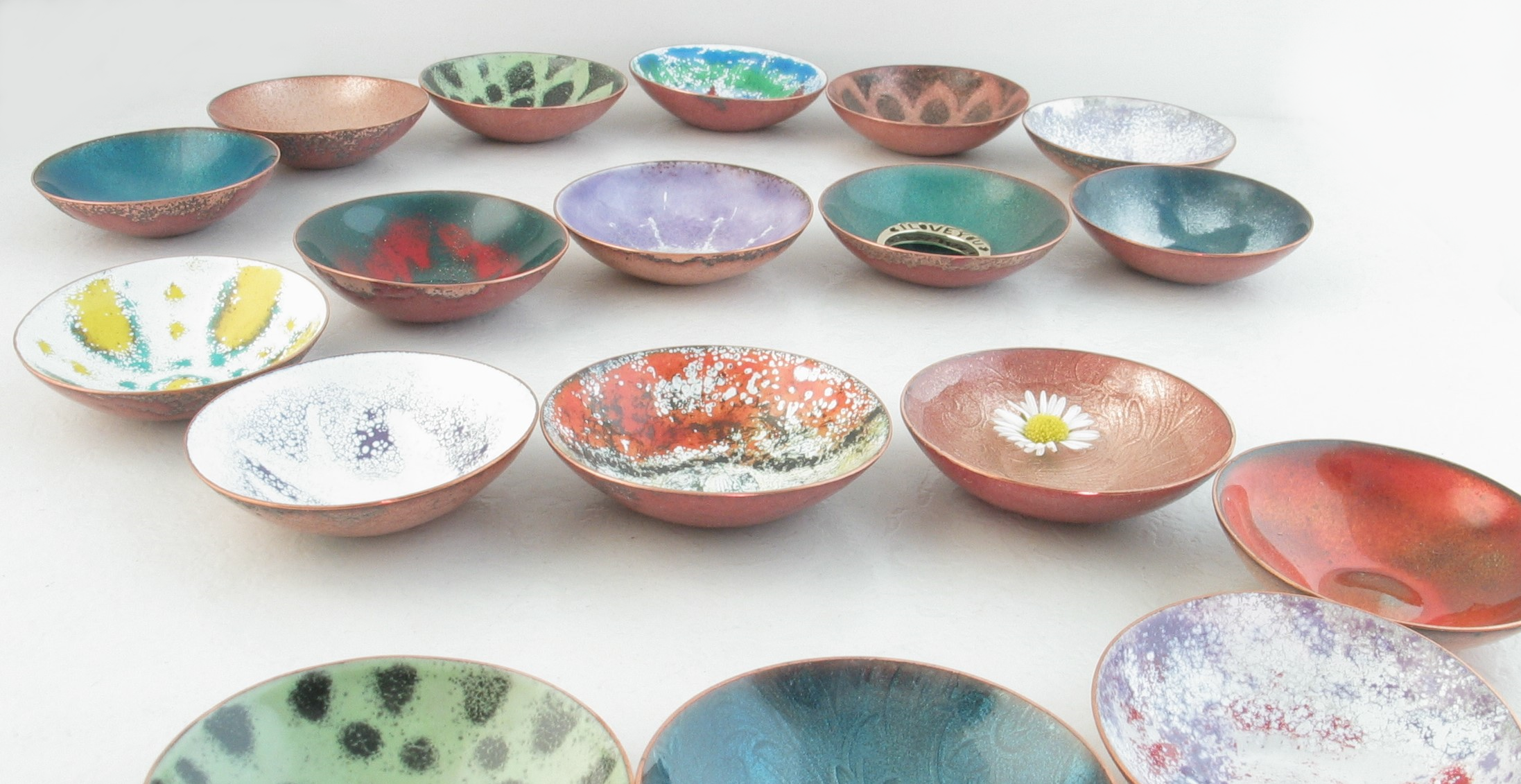 photo of many tiny trinket bowl of various colors