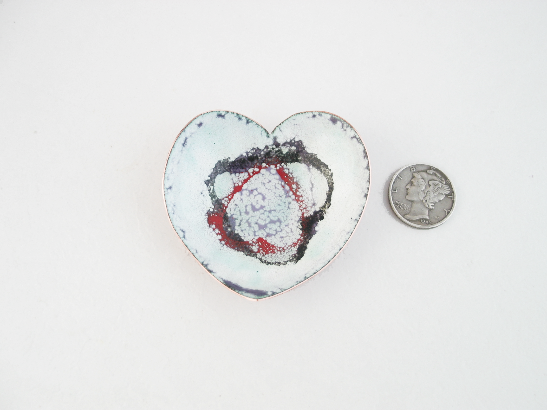 heart shaped copper enameled trinket ring dish with black and red hearts stenciled on shite, verdigris, purple