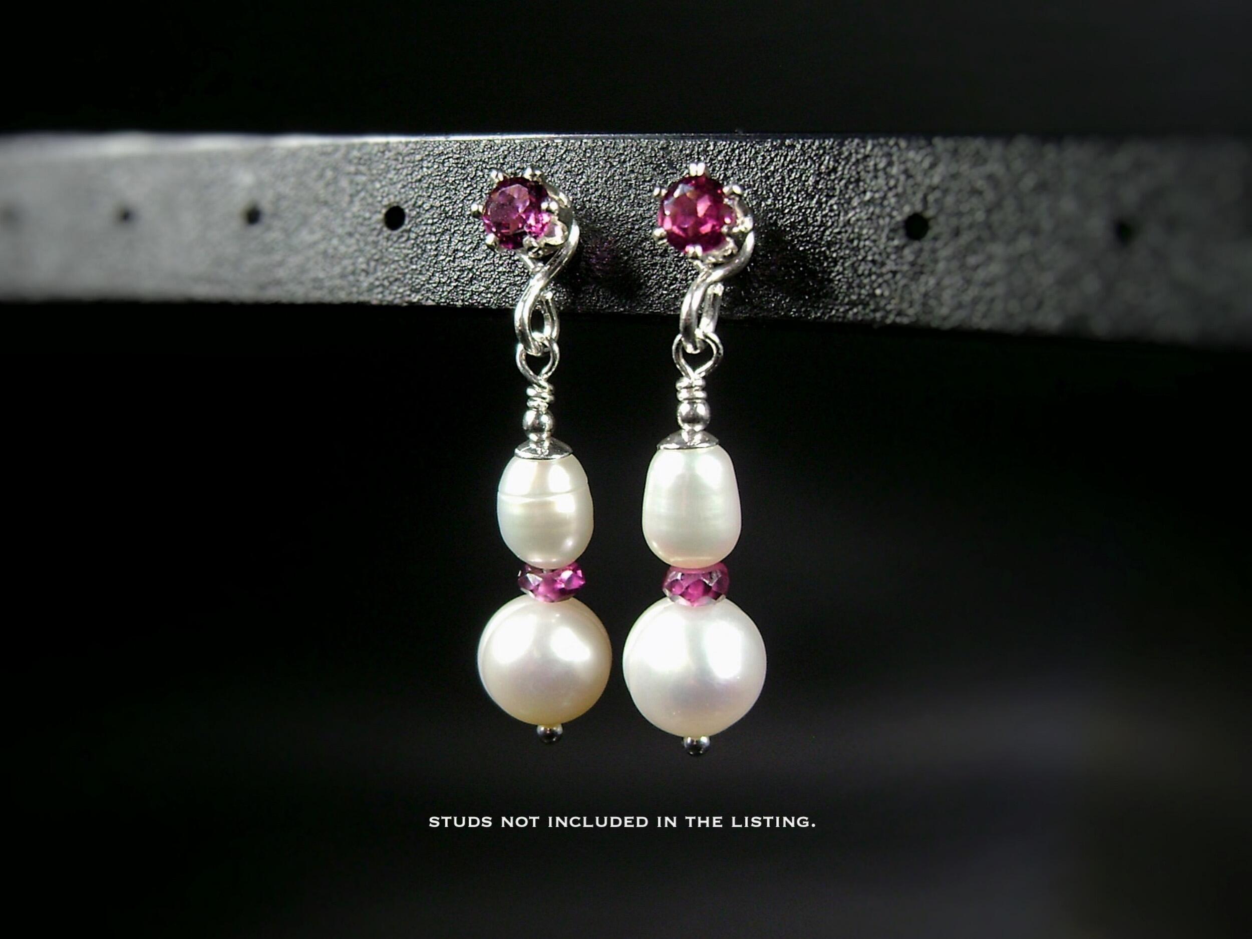 ​This is a lovely pair of pearl and rhodolite garnet earring jackets. They are made with cultured freshwater pearls and with faceted pink rhodolite rondelles and sterling silver beads. By MariesGems.