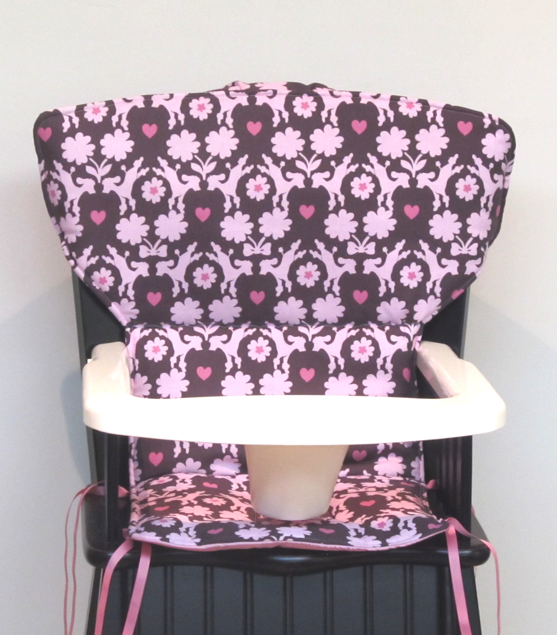 pink wooden high chair