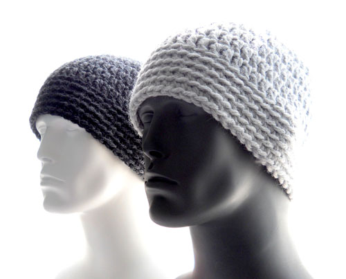 Two mannequins in classic beanie hats, one charcoal and the orher a light heather gray.