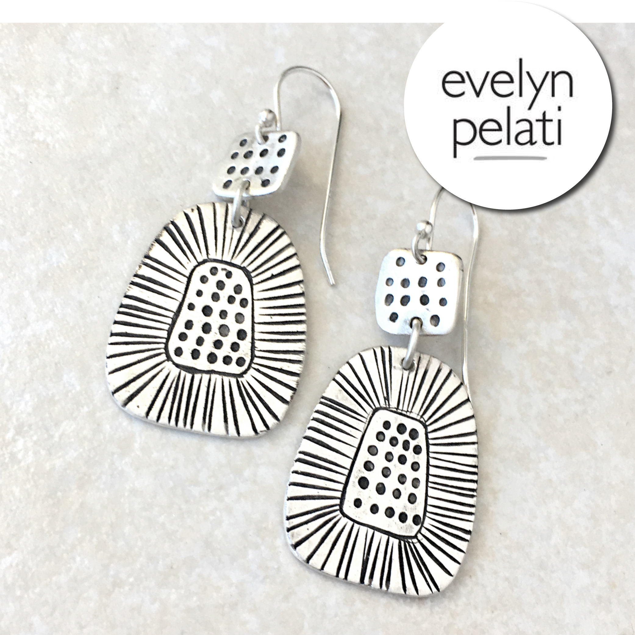 Artfully hand carved jewelry by Evelyn Pelati