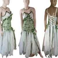 Green and white woodland wedding dress. Lace up back. The bodice has green crochet and flowers and leaves sewn into around the crochet. Lots of white tatters with occasional green. One of a kind, handmade, eco-friendly, bohemian style clothes. Green and white woodland wedding dress. Lace up back. The bodice has green crochet and flowers and leaves sewn into around the crochet. Lots of white tatters with occasional green. One of a kind, handmade, eco-friendly, bohemian style clothes.