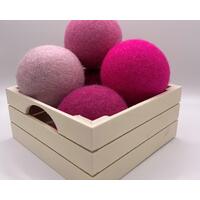 Pink dryer balls in box Pink dryer balls in box