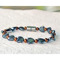 Magnetic bracelet handcrafted with alternating black magnetic hematite heart beads and copper metallic magnetic hematite beads. It is secured with a strong and easy-to--use magnetic clasp. Magnetic bracelet handcrafted with alternating black magnetic hematite heart beads and copper metallic magnetic hematite beads. It is secured with a strong and easy-to--use magnetic clasp.