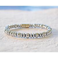 Magnetic bracelet handcrafted with silver metallic magnetic hematite beads. It is secured with a strong and easy-to-use magnetic clasp. Magnetic bracelet handcrafted with silver metallic magnetic hematite beads. It is secured with a strong and easy-to-use magnetic clasp.
