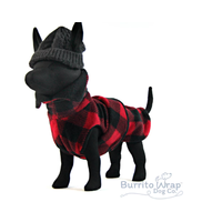 Small dog mannequin dressed in lumberjack red and black winter coat. Made out of fleece and the dog is wearing a little hat.