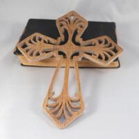 This Ten-Inch Rustic Fretwork Christian Cross Wall Hanging Art is handcrafted from reclaimed wood. Its intricate fretwork design adds unique texture and character, blending rustic charm with elegant design. It is a perfect focal point for any room. This Ten-Inch Rustic Fretwork Christian Cross Wall Hanging Art is handcrafted from reclaimed wood. Its intricate fretwork design adds unique texture and character, blending rustic charm with elegant design. It is a perfect focal point for any room.