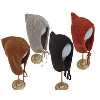 Handknit Baby Bonnet with seamless design for sensory considerations ties under the chin. Has a rounded edge. Colors include Cognac, Beige, Black, and Rust. Sizes 0-3 Months to 18-24 Months. Handknit Baby Bonnet with seamless design for sensory considerations ties under the chin. Has a rounded edge. Colors include Cognac, Beige, Black, and Rust. Sizes 0-3 Months to 18-24 Months.