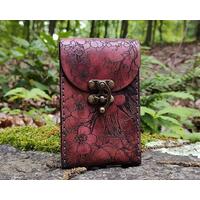 This is a Premium Leather Tarot Card Case covered on the front, back bottom and top with cherry blossoms - or Sakura. It's a handmade tarot deck box which has been hand dyed in Mahogany, and hand stitched in dark graphite grey. There's much to love about this Japanese inspired floral tarot card holder.

This premium leather case is hand dyed in Mahogany. The mahogany dye produces an antique look with many shades of red tones that wash over the entire case. The natural character of the real full grain leather combined with the hand dying process makes each case unique. 

Featuring artwork permanently etched into the leather in black:

The Sakura / Cherry Blossom art has been permanently engraved into the leather. The sakura branches and blossoms move completely around the case front to bottom to back to top, creating a wonderful flow and energy about it.