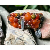 Glass and ceramic beads with two different leaf charms on a memory wire. Just beautiful! Glass and ceramic beads with two different leaf charms on a memory wire. Just beautiful!