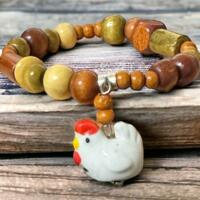 stretchy bracelet with a chicken charm. cute