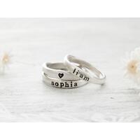 Free formed organic shaped sterling silver ring stamped with name and hearts.  Free formed organic shaped sterling silver ring stamped with name and hearts.