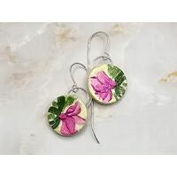 Round clay earrings with hand painted pink flowers and green leaves, large silver jump rings embedded and handcrafted silver earring wires. 