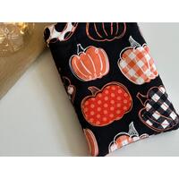 this pumpkin kindle sleeve has a black background with pumpkins having different prints on them this pumpkin kindle sleeve has a black background with pumpkins having different prints on them