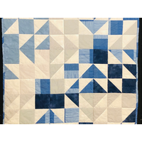 Blue, tan and white baby quilt
