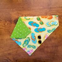 Reversible Over the collar dog bandana with flip flop print and green with white polka dots Reversible Over the collar dog bandana with flip flop print and green with white polka dots