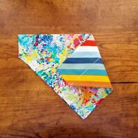 Over the collar reversible dog bandana paint splashes on one side stripes on the other Over the collar reversible dog bandana paint splashes on one side stripes on the other