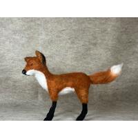 Red fox looking left, standing on all four black feet. Fox bushy tail, fox horse hair whiskers
 Red fox looking left, standing on all four black feet. Fox bushy tail, fox horse hair whiskers