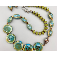 Necklace set | Blue-green ceramic planed ovals and disks, olive jade rondelles, Bali silver style tulip bead Necklace set | Blue-green ceramic planed ovals and disks, olive jade rondelles, Bali silver style tulip bead